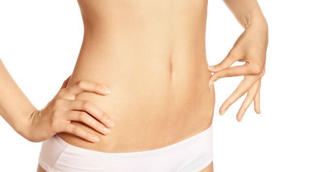 Liposuction female patient model with flat abs