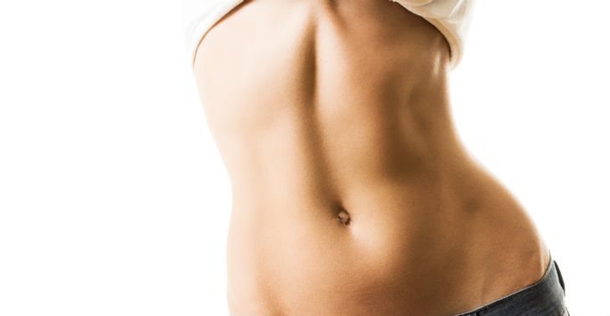 Tummy Tuck female patient model with flat abs