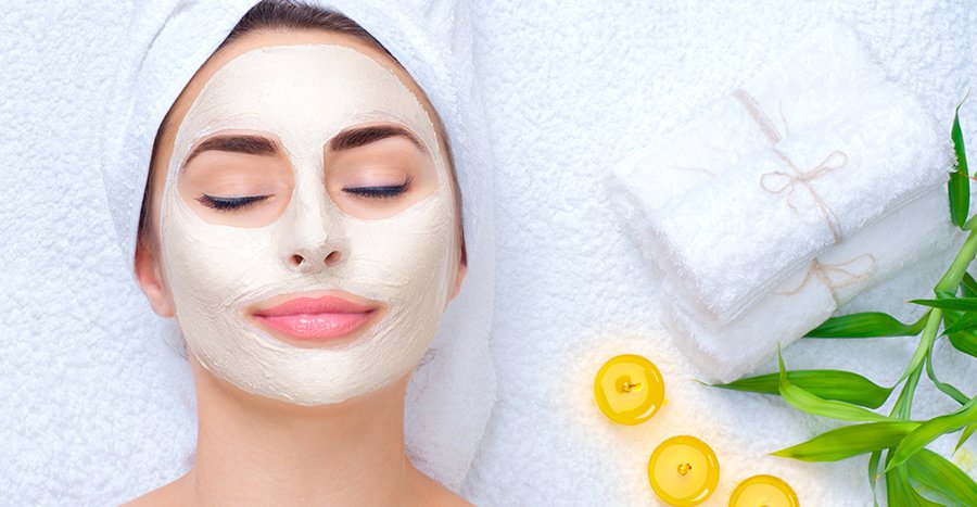 Female patient model wearing a white beauty mask