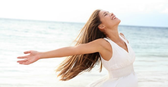 Beautiful patient model at the beach with white dress