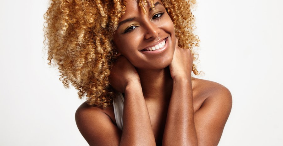 Woman smiling with curly hair