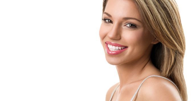 Female patient model with no wrinkles and smiling