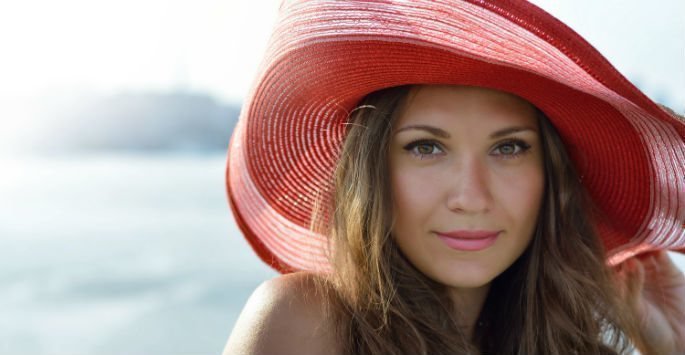 Beautiful female patient model with red hat